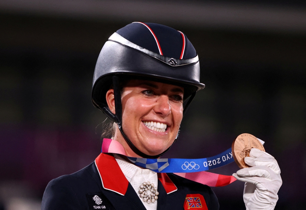 Britain’s joint-most decorated female Olympian Charlotte Dujardin pulled out of the Paris Games yesterday and was provisionally suspended after equestrian’s governing body launched an investigation into her conduct. — Reuters pic