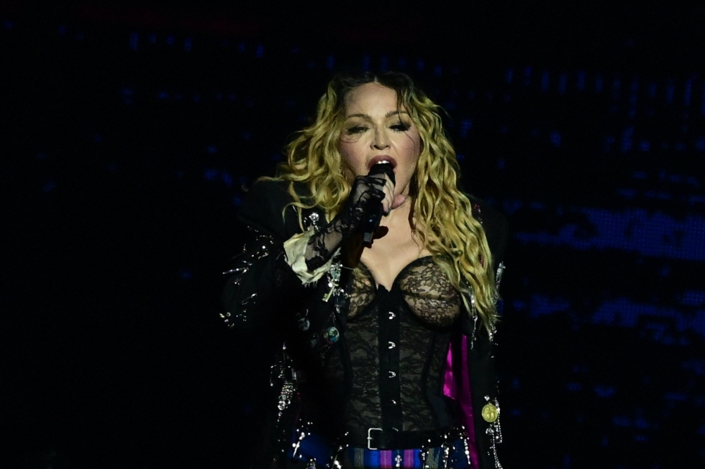 Madonna performs onstage during a free concert at Copacabana beach in Rio de Janeiro. Geoff Luck studied the rhythmic evolution of the repertoire of 10 successful singers and  found that Madonna and Elton John showed the greatest variation in tempos since the start of their careers. — AFP pic