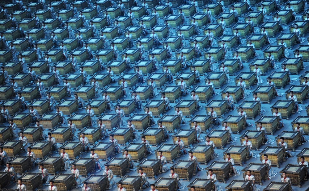 Percussionists perform with their fou drums, ancient Chinese percussion instruments, during the opening ceremony of the 2008 Beijing Olympic Games in Beijing on August 8, 2008. — AFP pic