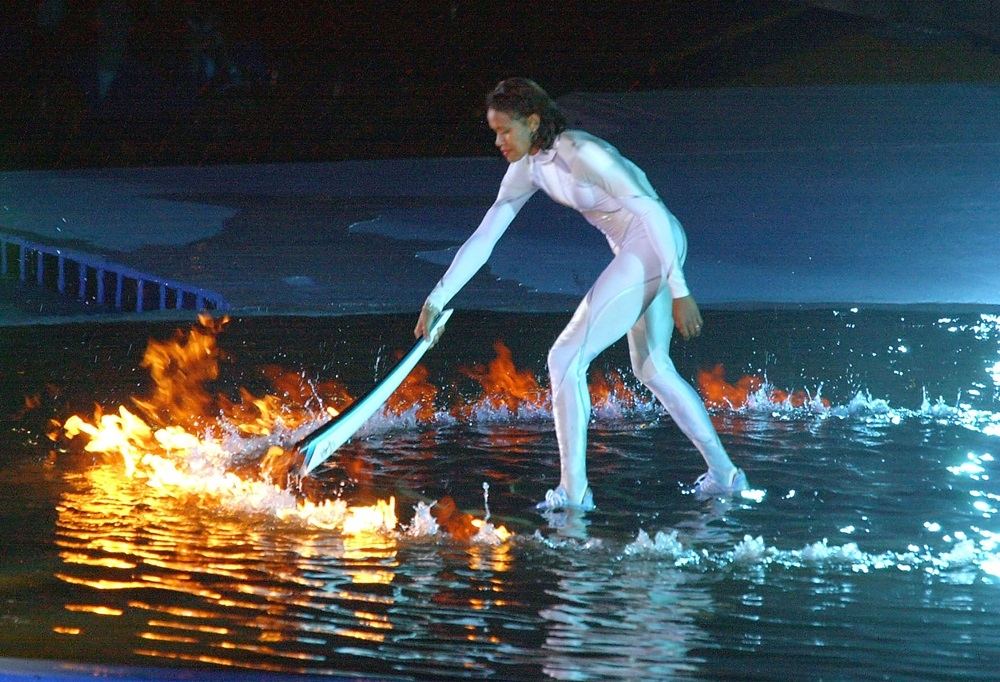 Australian sporting icon Cathy Freeman lights the Olympic cauldron September 15, 2000 in Sydney to ignite the 27th Olympiad of the modern era. — AFP pic