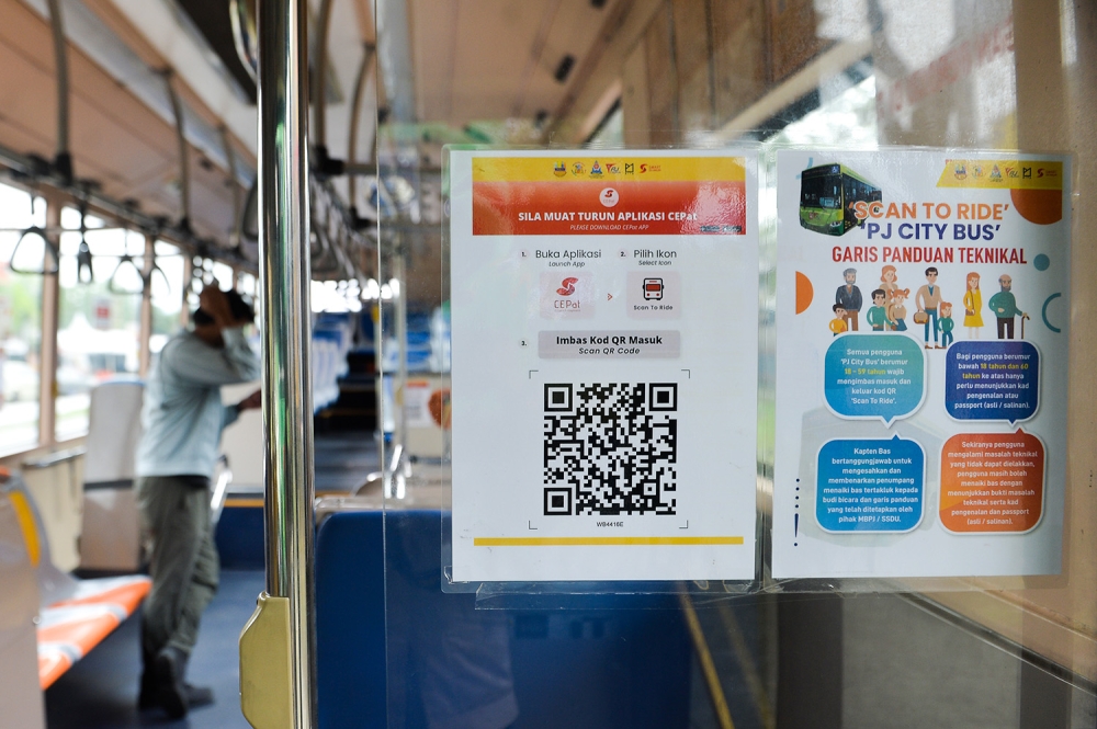 A QR code is displayed near the entrance of a Smart Selangor bus. — Picture by Miera Zulyana