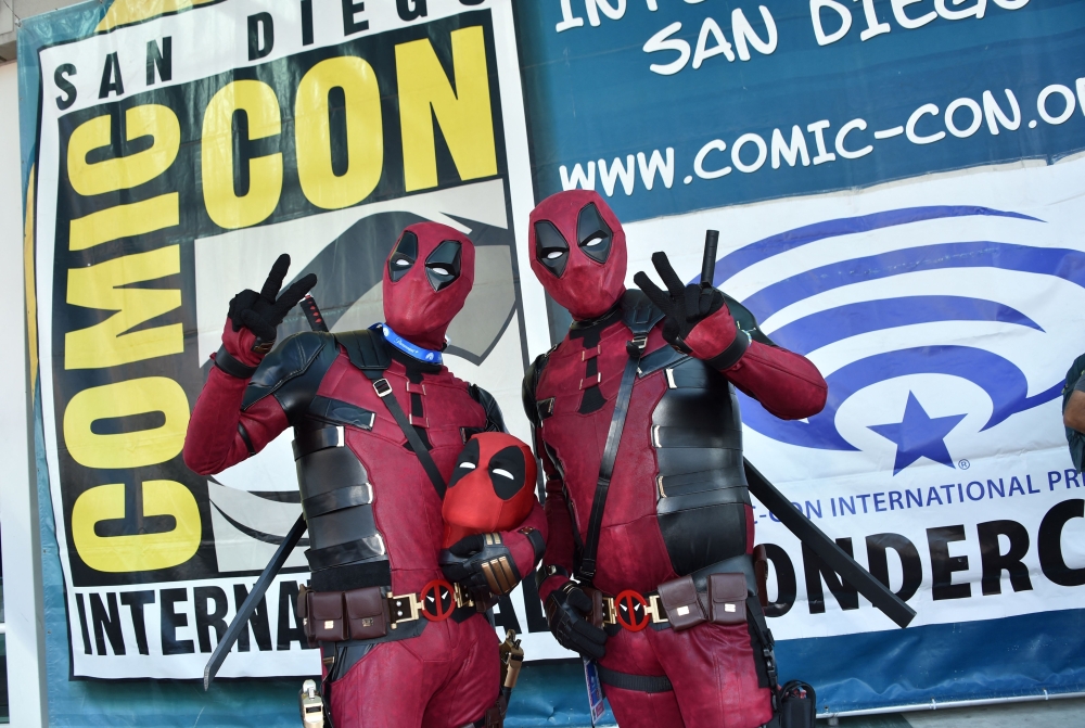 Deadpool cosplayers pose during Comic Con International in San Diego July 25, 2024. — AFP pic