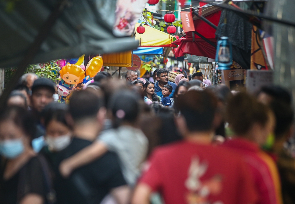 A file photograph shows crowds at Concubine Lane in Ipoh’s Old Town. Such a sight is now common both on weekdays and weekends. — Picture by Farhan Najib