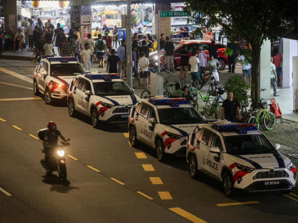 Police cars parked along Geylang Road on July 21, 2024. — Nuria Ling/TODAY