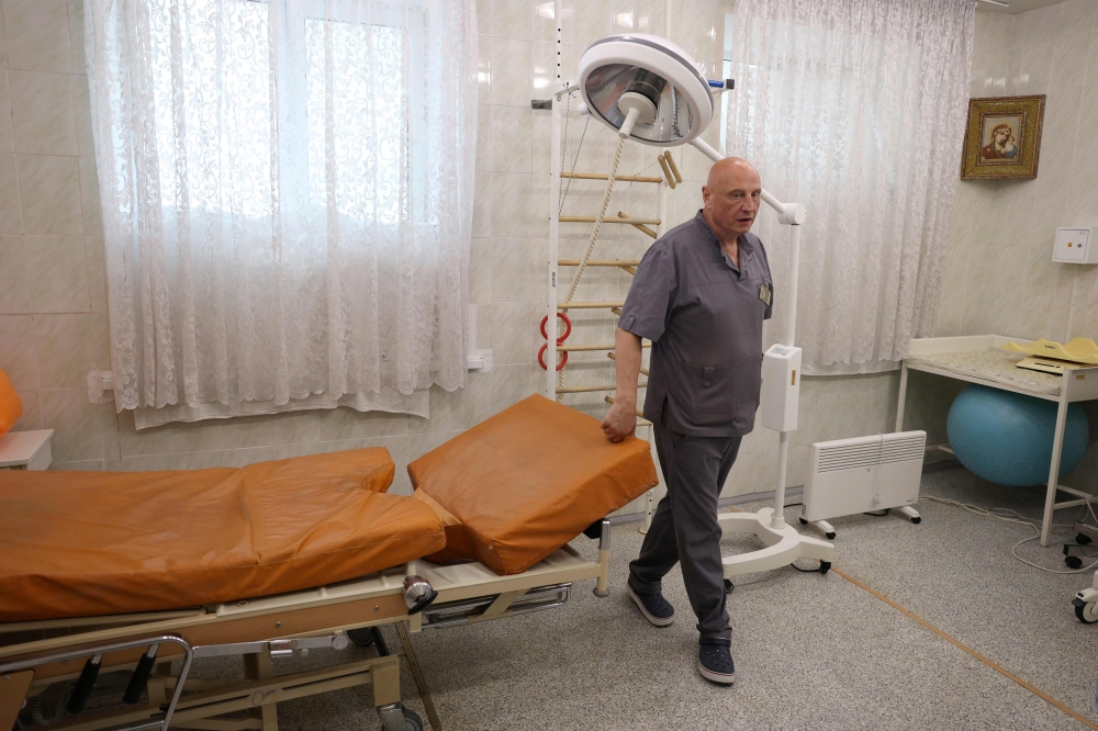 Ukrainian head of the Perinatal centre, Ivan Tsyganok, stands in the delivery room of his center in Pokrovsk, Donetsk. — AFP pci