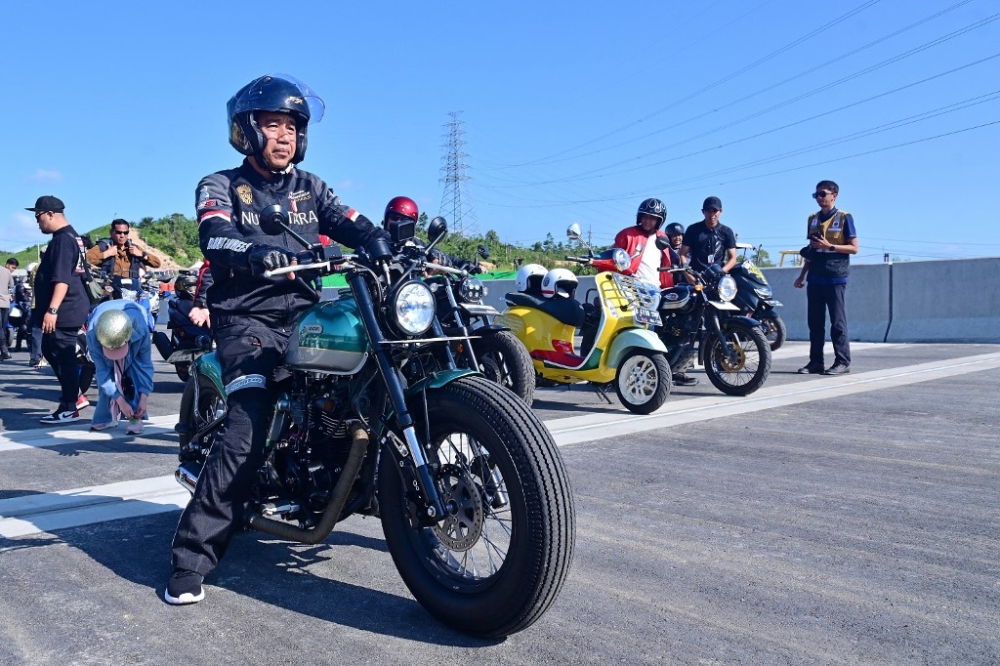 On Sunday, the president donned a black touring jacket and rode Nusantara’s new toll road on a motorcycle, flanked by several government officials and social media influencers. — AFP pic