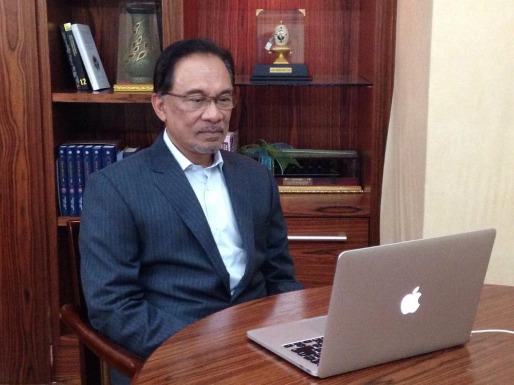 Prime Minister Datuk Seri Ibrahim's classic photo with a laptop has become a popular Malaysian meme. — Picture via Twitter