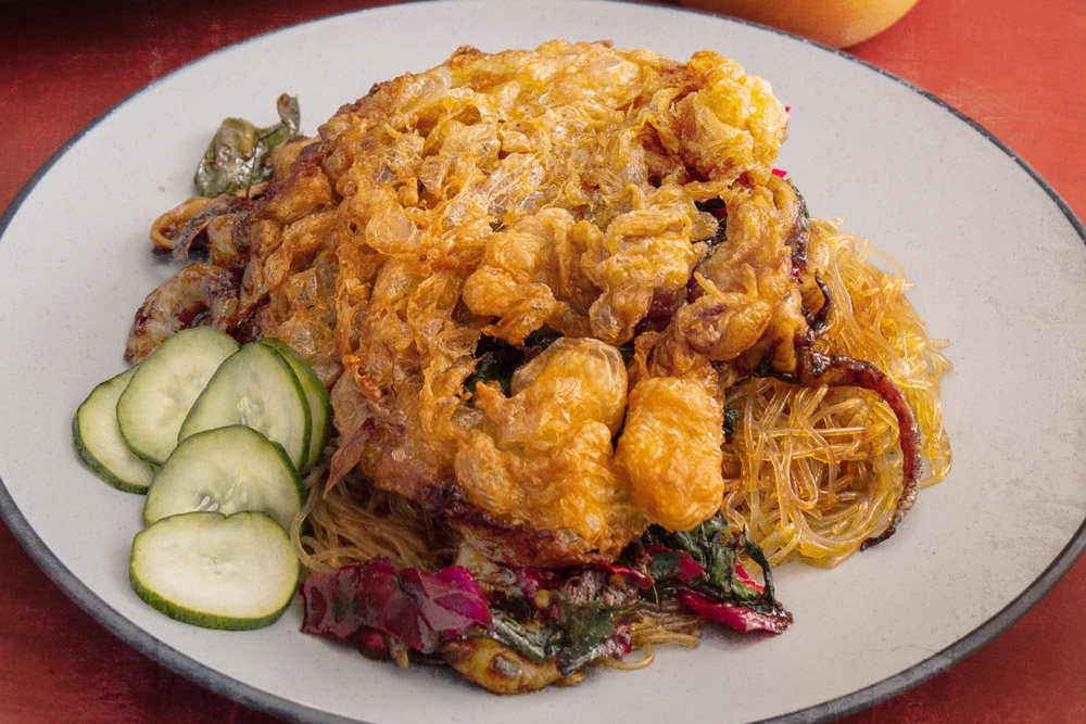 Pad Krapao Seafood Mix with Khai Jiao (Thai omelette) on glass noodles. — Pictures courtesy of Pad Boy