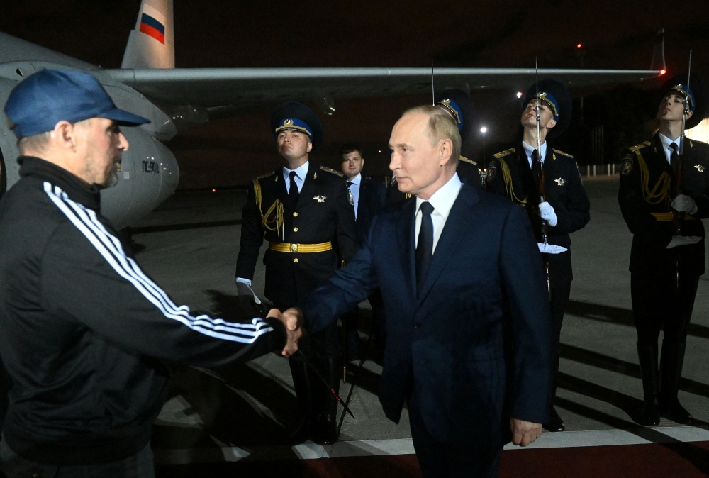 Russia’s President Vladimir Putin greets Russian national Vadim Krasikov, who was released in a prisoner exchange between Russia with Western countries, during a welcoming ceremony at Vnukovo International Airport in Moscow August 1, 2024. — Reuters pic