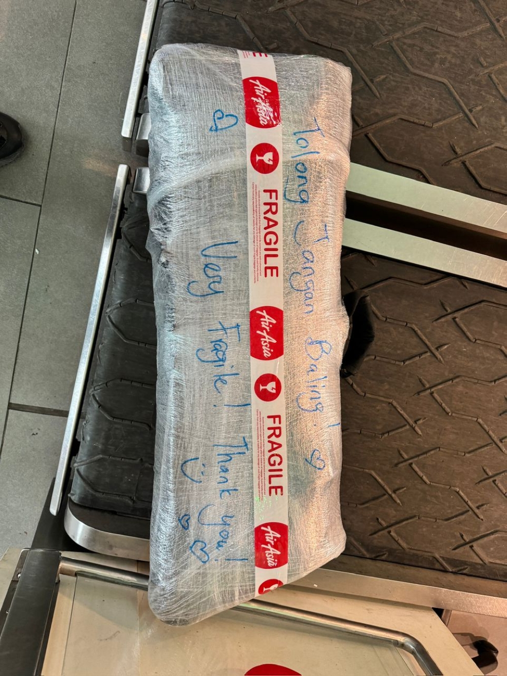 Tan's keyboard was securely wrapped in cling film for check-in. — Picture from Nicholas Tan Tze Zhung