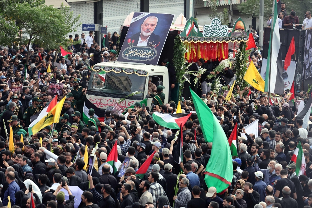 Iranians take part in a funeral ceremony for late Hamas leader Ismail Haniyeh, in Tehran, on August 1, 2024. — AFP pic 