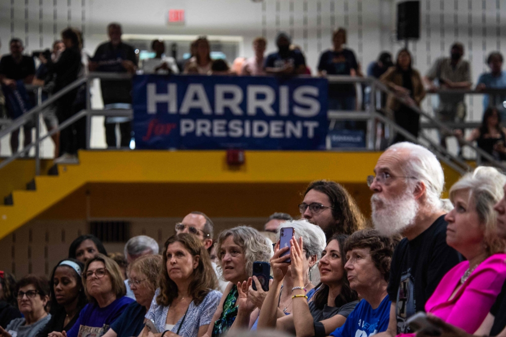 Attendees listen during a ‘Harris for President’ event featuring Michigan Governor Gretchen Whitmer and Pennsylvania Governor Josh Shapiro in the gymnasium of Wissahickon High Schoolin Ambler, Pennsylvania July 29, 2024. — AFP pic