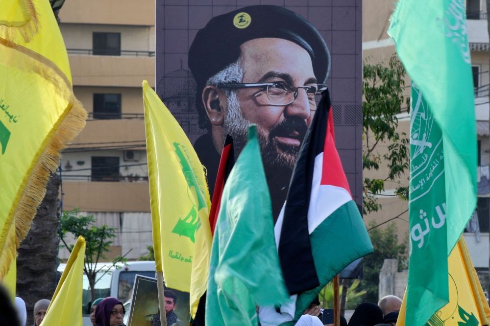 A portrait of slain Hezbollah military commander Fuad Shukr is displayed during a a demonstration denouncing his killing and that of the Palestinian militant Hamas group chief, in the Lebanese coastal city of Sidon, on August 2, 2024. — AFP pic