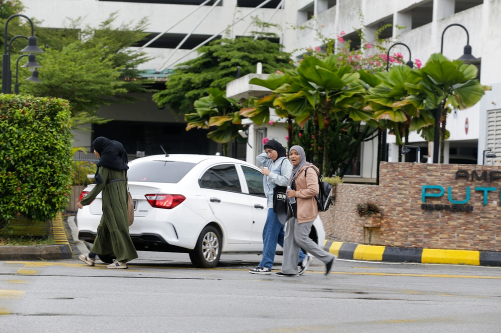 Arab or Central Asian teenagers are part of Ampang’s highly diverse population. Ampangites rarely talk about it as a unique phenomenon because this diversity has become normal. — Picture By Raymond Manuel