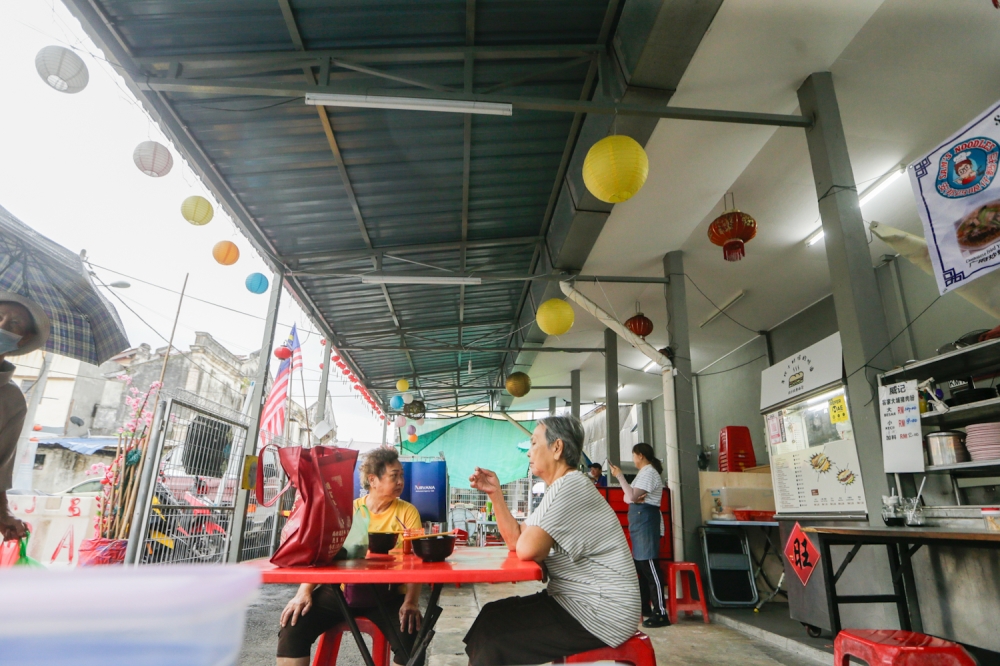 Sit down and enjoy some home-food cooked with love. Pan mee and ‘apam balik’ are some of the things you can enjoy your ‘cham’ or ‘kopi’ with while watching everything move in near slow motion. — Picture By Raymond Manuel