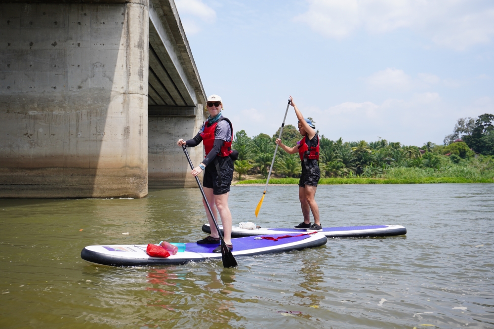 One person in this photo has been doing SUP for a while now, and the other just picked it up that morning. Can you tell who? — Pictures by Nomad Adventure