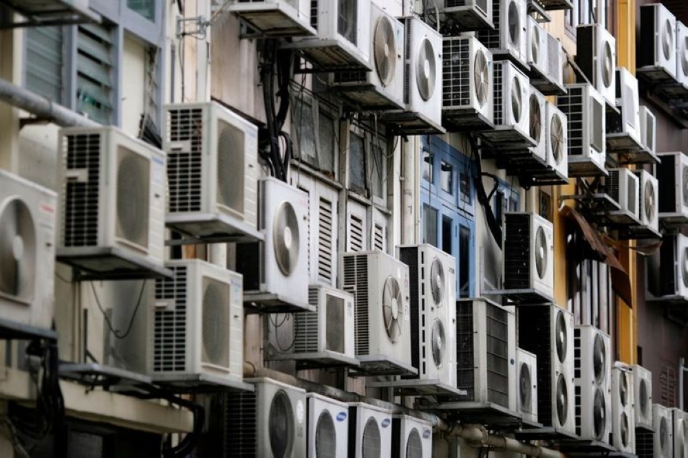 Not everyone can afford to have air conditioning at home. — Reuters pic