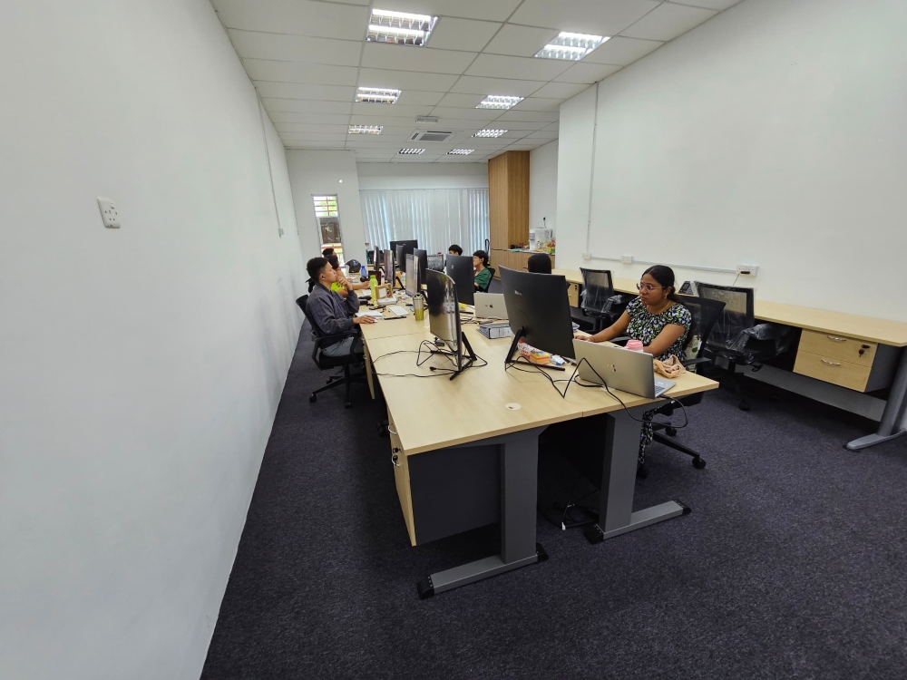 Interns and staff at work at Axcell Solution in Kampar. — Picture courtesy of Gan Chee Tak.