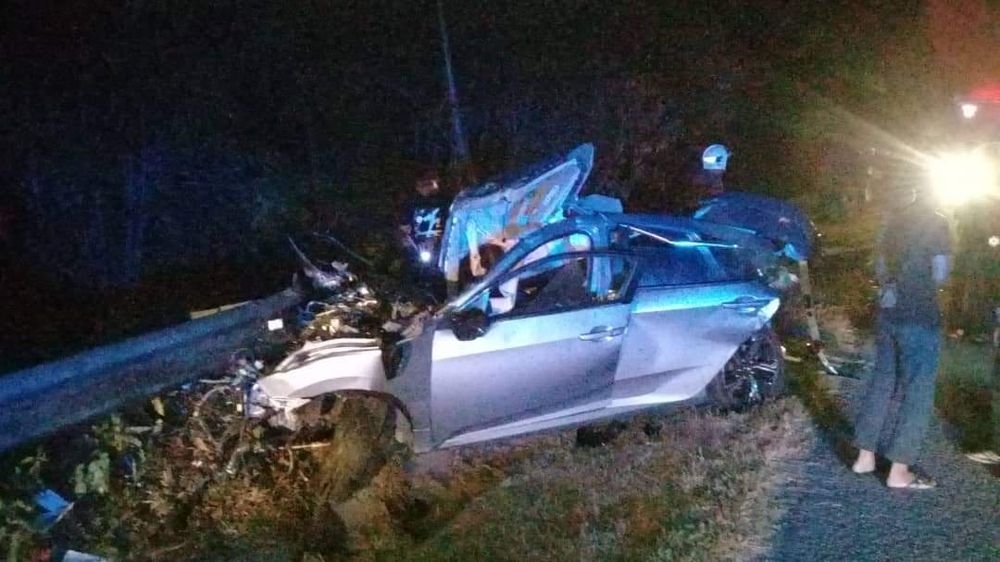 A file photograph showing a car smashed against a guardrail. Transport Minister Anthony Loke said it was worrying that one in 13 drivers tested positive for drugs while behind the wheel during a recent operation starting August 1, 2024. — Picture from Facebook/Info Kemalangan Jalan Raya (IKJR)