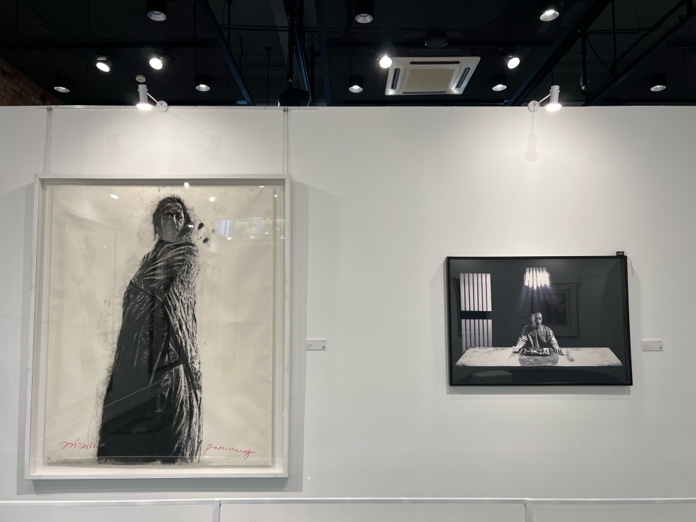 ‘Pawang’ by Jalaini Abu Hassan (left) and ‘Chronicles of Crime: Last Supper’ by Wong Hoy Cheong. — Picture by Opalyn Mok