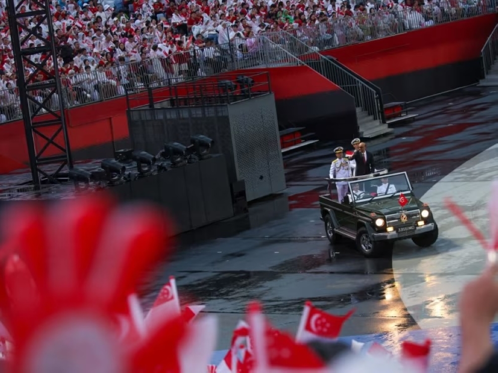 President Tharman Shanmugaratnam waves to the crowds at the National Day Parade 2024 at the Padang in Singapore August 9, 2024. — TODAY pic