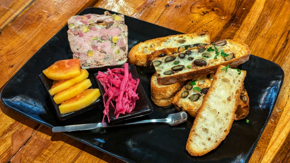 Housemade Country Pâté makes for a good grazing platter to start with sourdough bread. — Picture by Ethan Lau