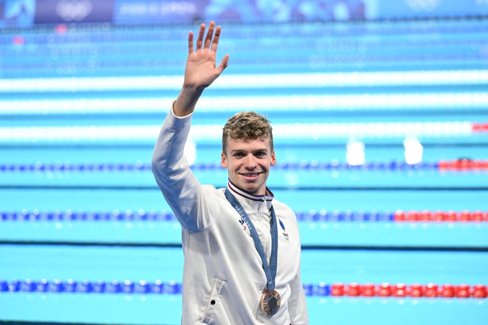 A new star was born in the Paris pool with Leon Marchand enthralling packed houses at La Defense Arena by completing a feat not seen since the days of Michael Phelps. — AFP pic