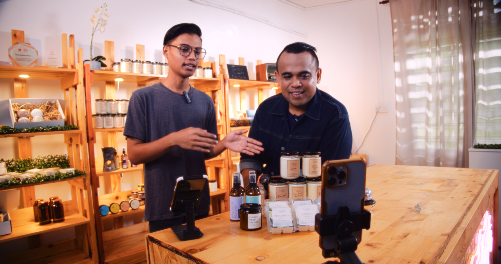 Founder of Lampu Cherita Mohd Zaid Othman (right) and his brother Mohd Hakimi livestreaming on Shopee Live.