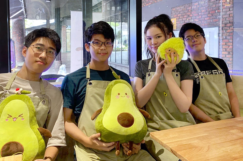 Bo The Avocado’s staff with avocado-themed toys. — Picture courtesy of Bo The Avocado