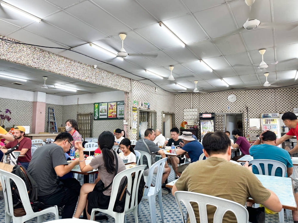 Once quiet, the coffee shop is now bustling with locals and tourists. — Picture by Lee Khang Yi