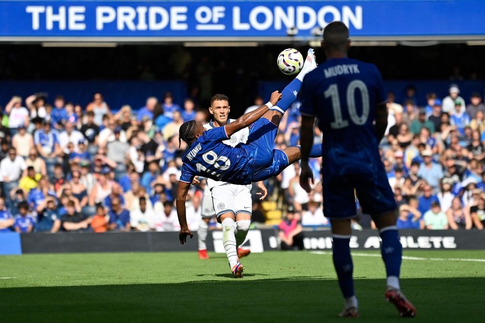 Chelsea's French striker Christopher Nkunku attempts an overhead bicycle kickk but fails to score during the pre-season friendly football match between Chelsea and Inter Milan at the Stamford Bridge stadium in London on August 11, 2024. — AFP pic