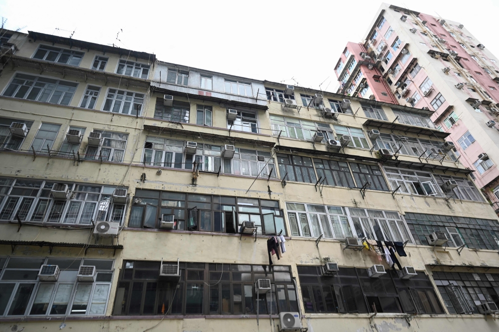 This photo taken on August 10, 2024 shows a general view of the apartment block where retired janitor Chun Loi, 84, lives in her 50-square-foot windowless one-room flat in Hong Kong. — AFP pic