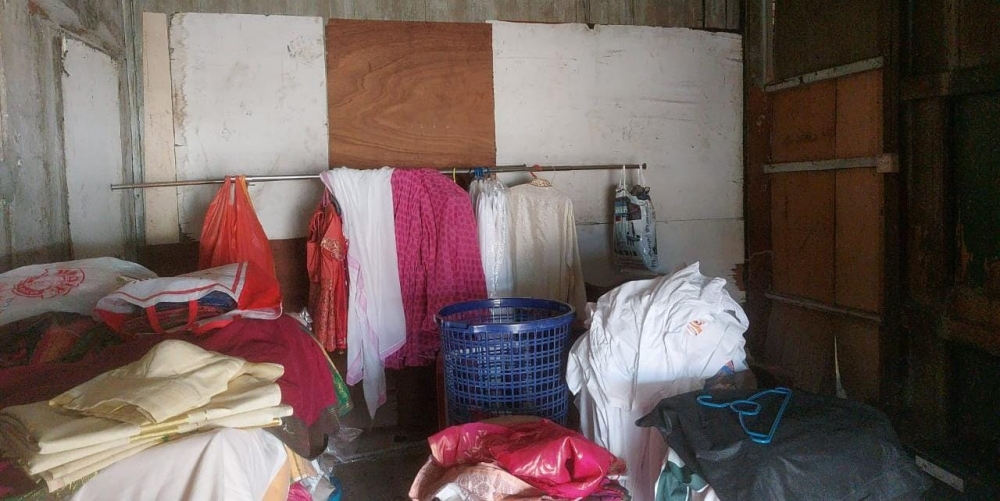 Dried clothes are kept in a room before they are brought out for ironing later. —Picture by Sylvia Looi