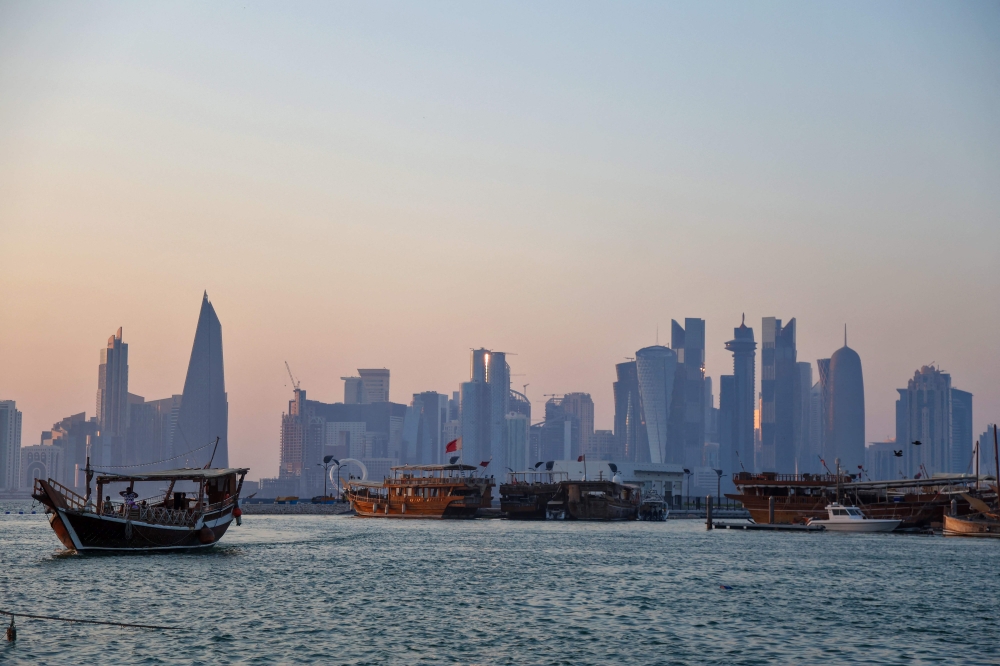 This picture taken from Doha's seaside promenade shows traditional Qatari Dhow boats with the Qatari capital's skyline seen in the background on August 16, 2024. Washington hopes a ceasefire agreement in Gaza can defuse the risk of a wider war. — AFP pic