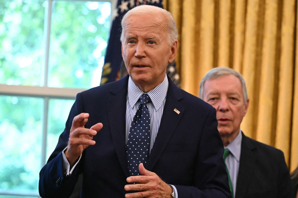 US President Joe Biden speaks about a Gaza ceasefire deal before signing a proclamation to designate the Springfield 1908 Race Riot National Monument, in the Oval Office of the White House in Washington, DC, August 16, 2024. — AFP pic