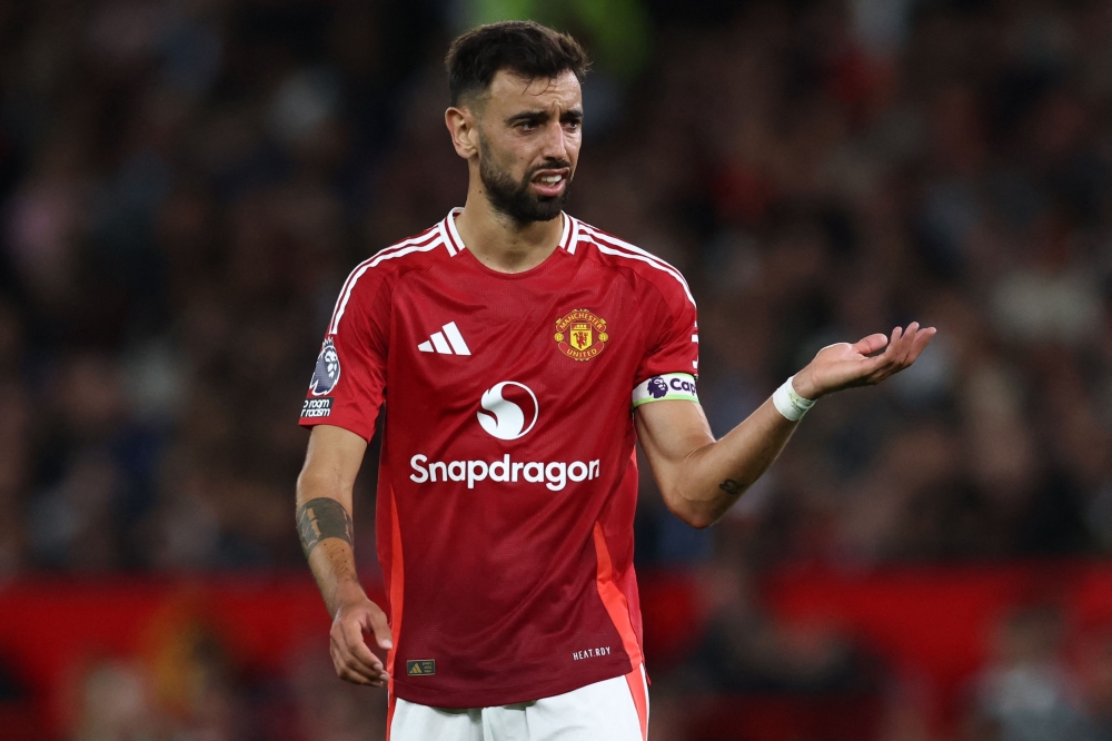 Manchester United's Portuguese midfielder #08 Bruno Fernandes gestures during the English Premier League football match between Manchester United and Fulham at Old Trafford in Manchester August 16, 2024. — AFP pic