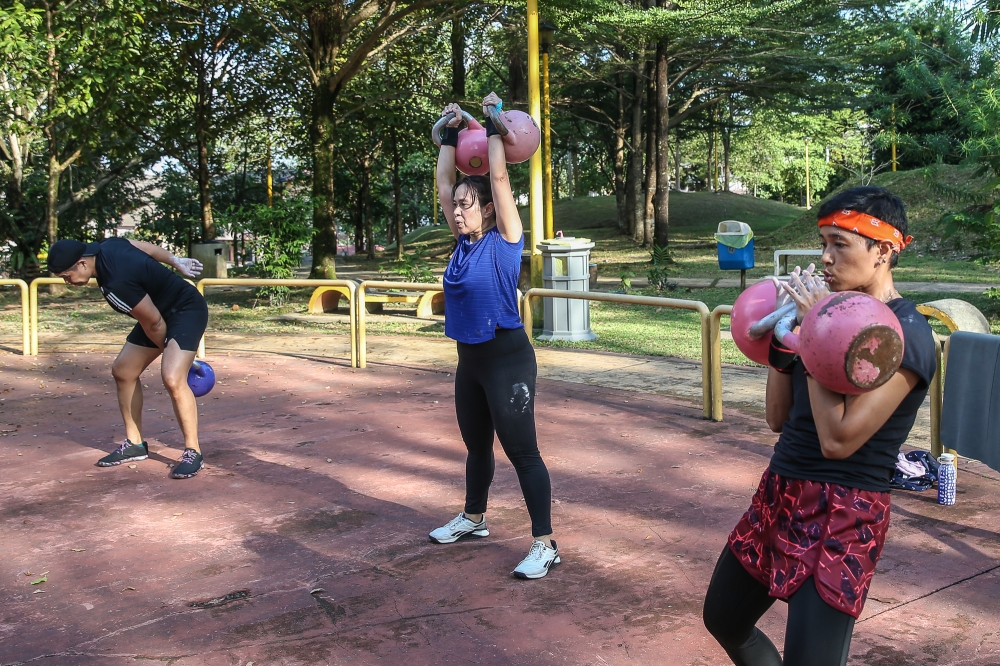 Bunga Raya Kettlebell Club (BRKC) members going through their paces at the Bangkung park. — Picture by Yusof Mat Isa