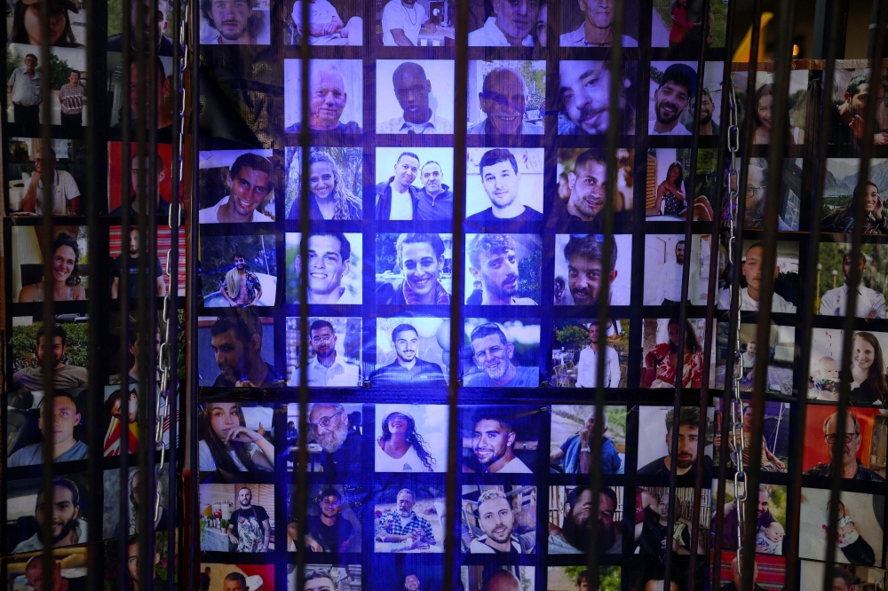 Pictures of hostages kidnapped during the deadly October 7 attack on Israel by Hamas are displayed, on the day of a march from families of the hostages, amid a new round of Israel-Gaza ceasefire talks, in Tel Aviv, Israel, August 15, 2024. — Reuters pic  