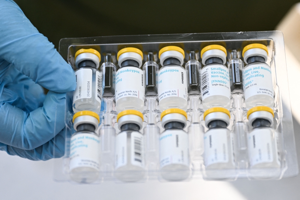 This file photo taken on August 9, 2022 shows vials of the Jynneos Monkeypox vaccine are prepared at a pop-up vaccination clinic in Los Angeles, California. — AFP pic