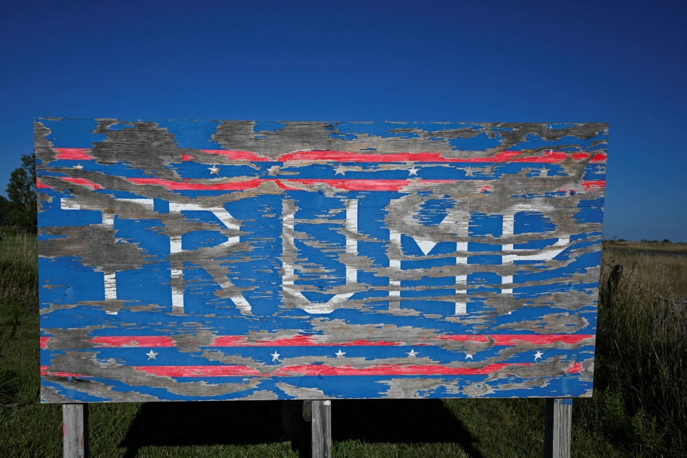 A tattered sign of support for Republican presidential nominee and former US President Donald Trump stands in Overton, Nebraska August 16, 2024. — Reuters pic  