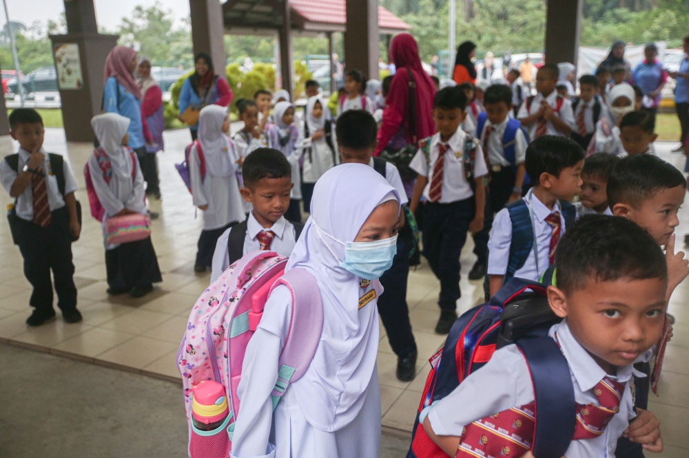 File picture of students on the first day school at Sekolah Kebangsaan Meru Raya in Ipoh March 20, 2023. — Picture by Farhan Najib