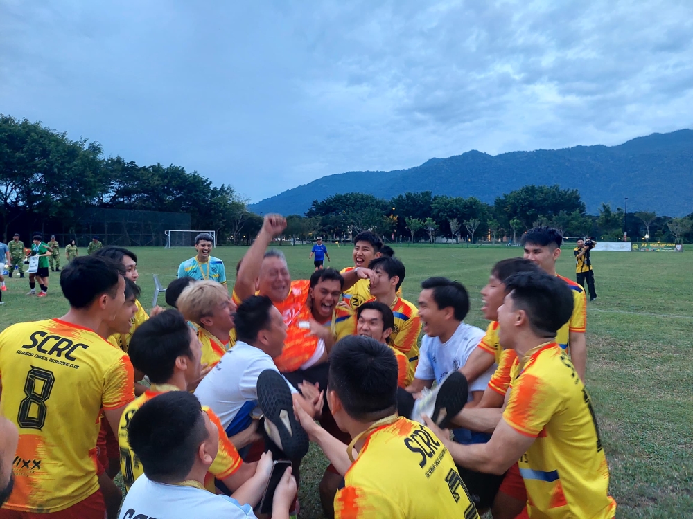 A jubilant Selangor team tosses their coach, Ong Mok Hooi. — Picture courtesy of Tony Mariadass.