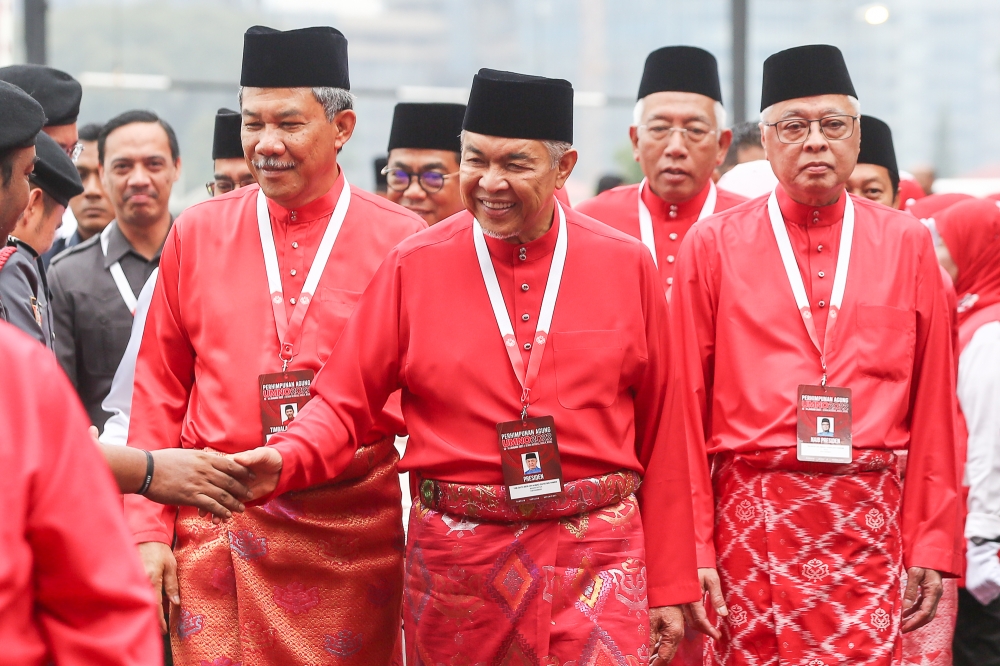 (Left to right) Umno deputy president Datuk Seri Mohamad Hasan, Umno president Datuk Seri Ahmad Zahid Hamidi and Umno vice-president Datuk Seri Ismail Sabri Yaakob arrive at World Trade Centre in Kuala Lumpur on January 13, 2023. — Picture by Yusof Mat Isa