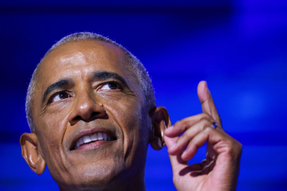 Former US President Barack Obama gestures as he speaks during Day 2 of the Democratic National Convention (DNC) in Chicago, Illinois August 20, 2024. — Reuters pic  