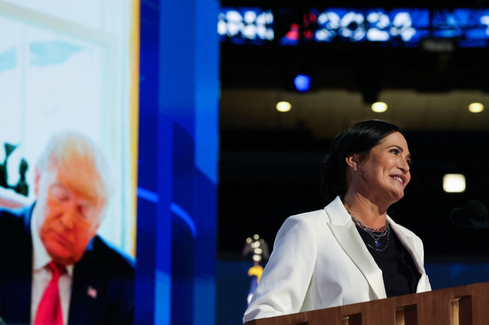 Republican presidential nominee and former US President Donald Trump is projected on a screen as Stephanie Grisham, former Trump White House Press Secretary speaks on Day 2 of the Democratic National Convention (DNC) at the United Center, in Chicago, Illinois August 20, 2024. — Reuters pic