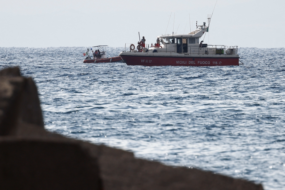 Rescue boats operate on the sea to search for the missing, including British entrepreneur Mike Lynch, after a luxury yacht sank off the coast of Porticello, near the Sicilian city of Palermo August 20, 2024. — Reuters pic  