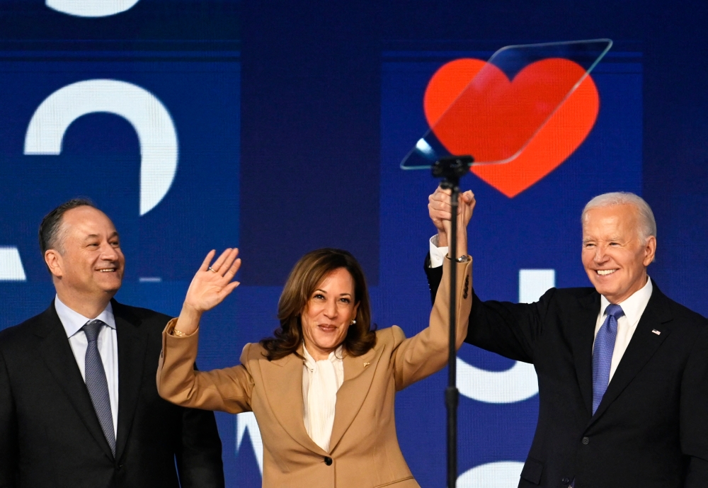 US President Joe Biden, Democratic presidential candidate and US Vice President Kamala Harris and Second Gentleman Doug Emhoff stand on stage during Day one of the Democratic National Convention (DNC) in Chicago, Illinois August 19, 2024. — Reuters pic