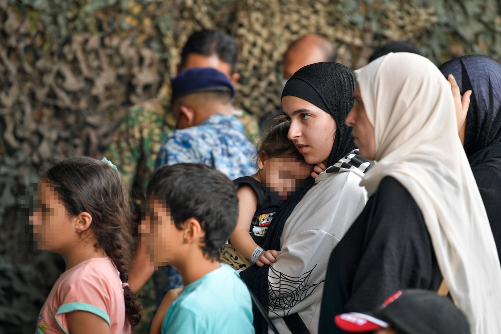 Injured Palestinian civilians from the Gaza conflict arrive, for treatment, at the Royal Malaysian Air Force Base in Subang August 16, 2024. — Bernama pic