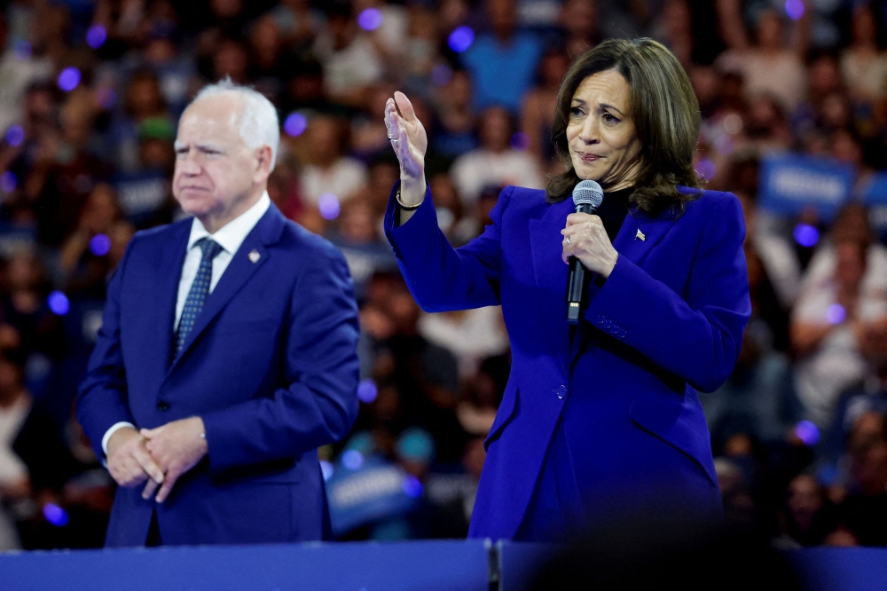 US Vice President and Democratic presidential nominee Kamala Harris and vice presidential nominee Minnesota Governor Tim Walz attend a campaign rally in Milwaukee, Wisconsin August 20, 2024. — Reuters pic  