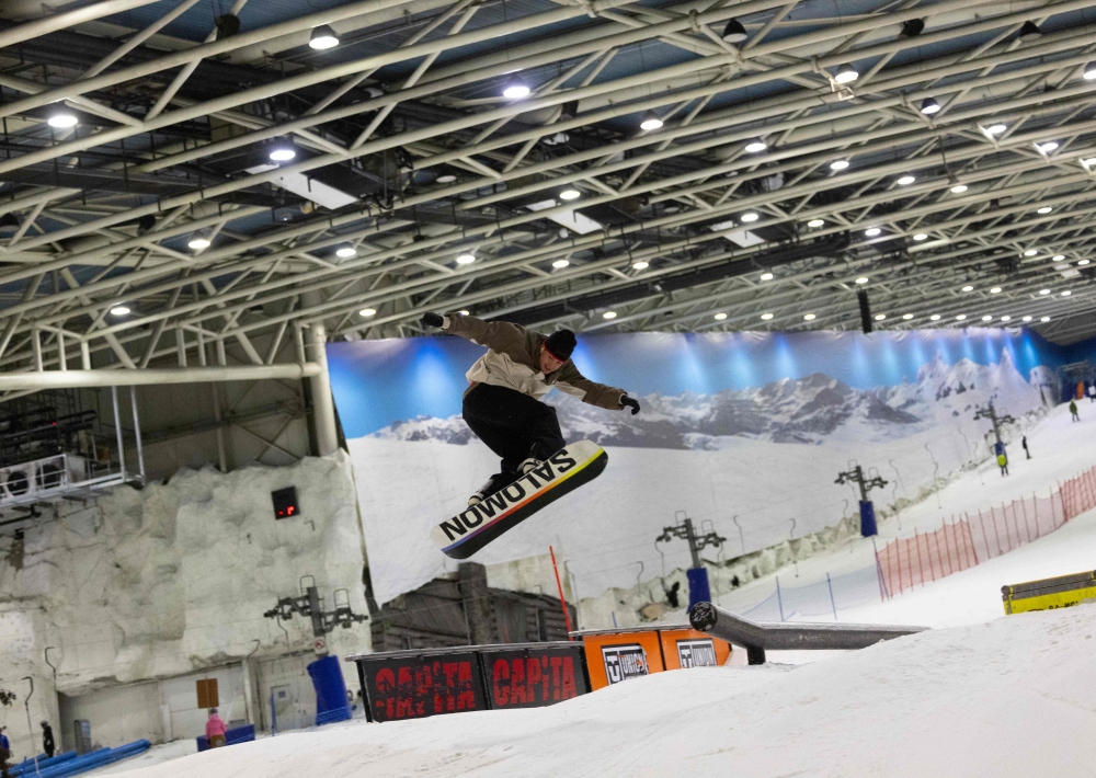 A snowboarder enjoys a run at Xanadu Snozone, the only indoor ski slope in Spain, located in Arroyomolinos, south of Madrid on August 19, 2024. — AFP pic